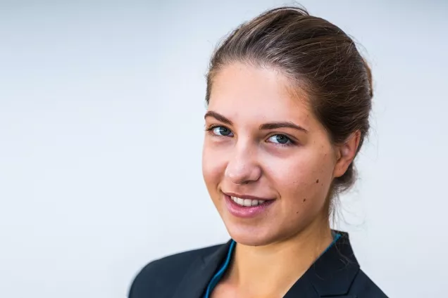 Picture of Alexandra Seger against a white wall.