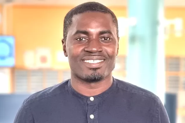 Picture of Joachim Tetteh Siaw standing in the lunch room area.