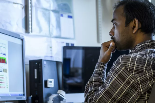 Picture of researcher checking files.